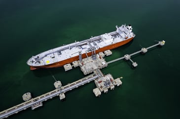 An oil tanker in a port using onboard vibration monitoring systems