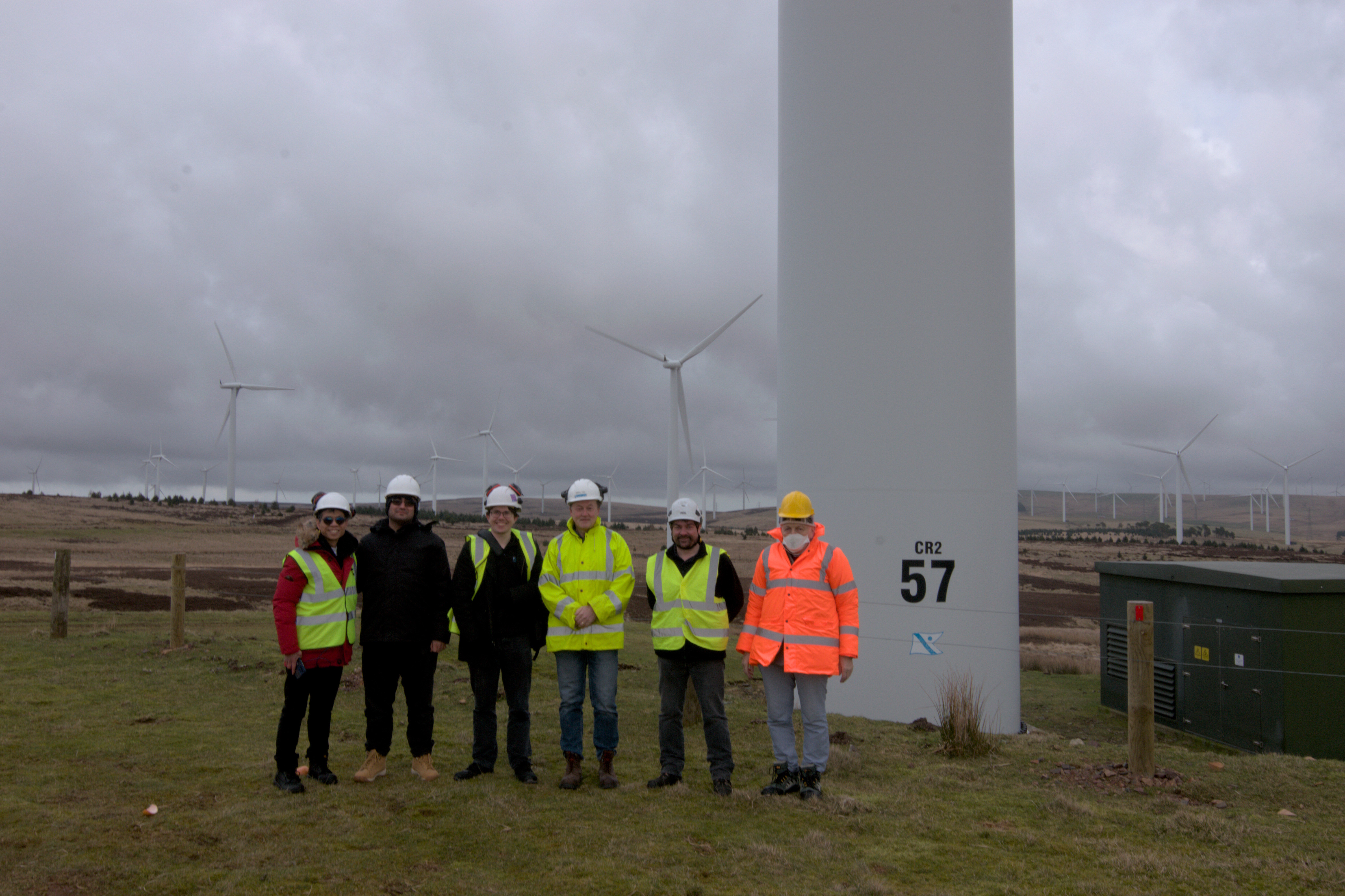 A collaborative team at the Crystal Rig II Wind Farm doing research for wind turbine monitoring.