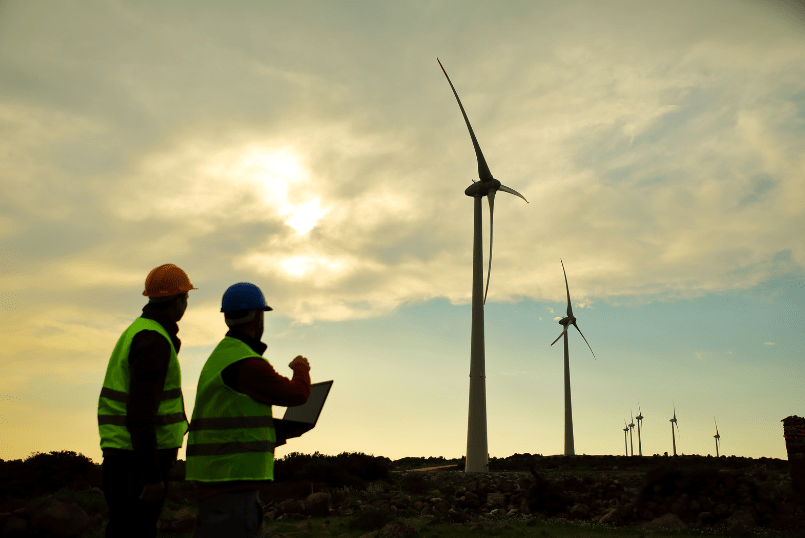 Two site employees discussing the challenges of wind turbine life extension and how they are planning to overcome these.